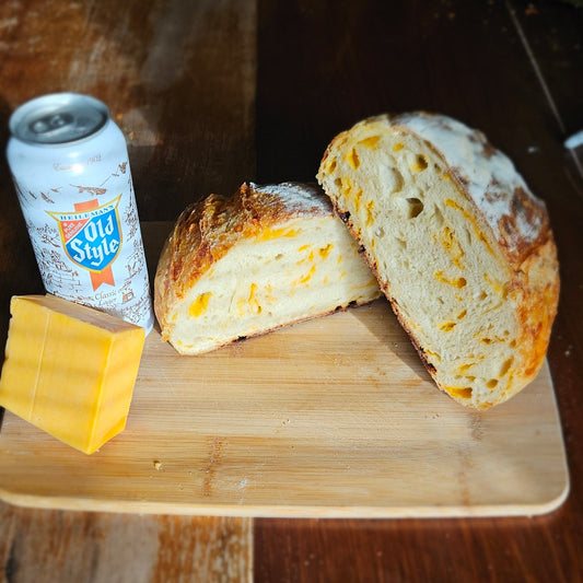 Sliced bread and a can on a wooden cutting board